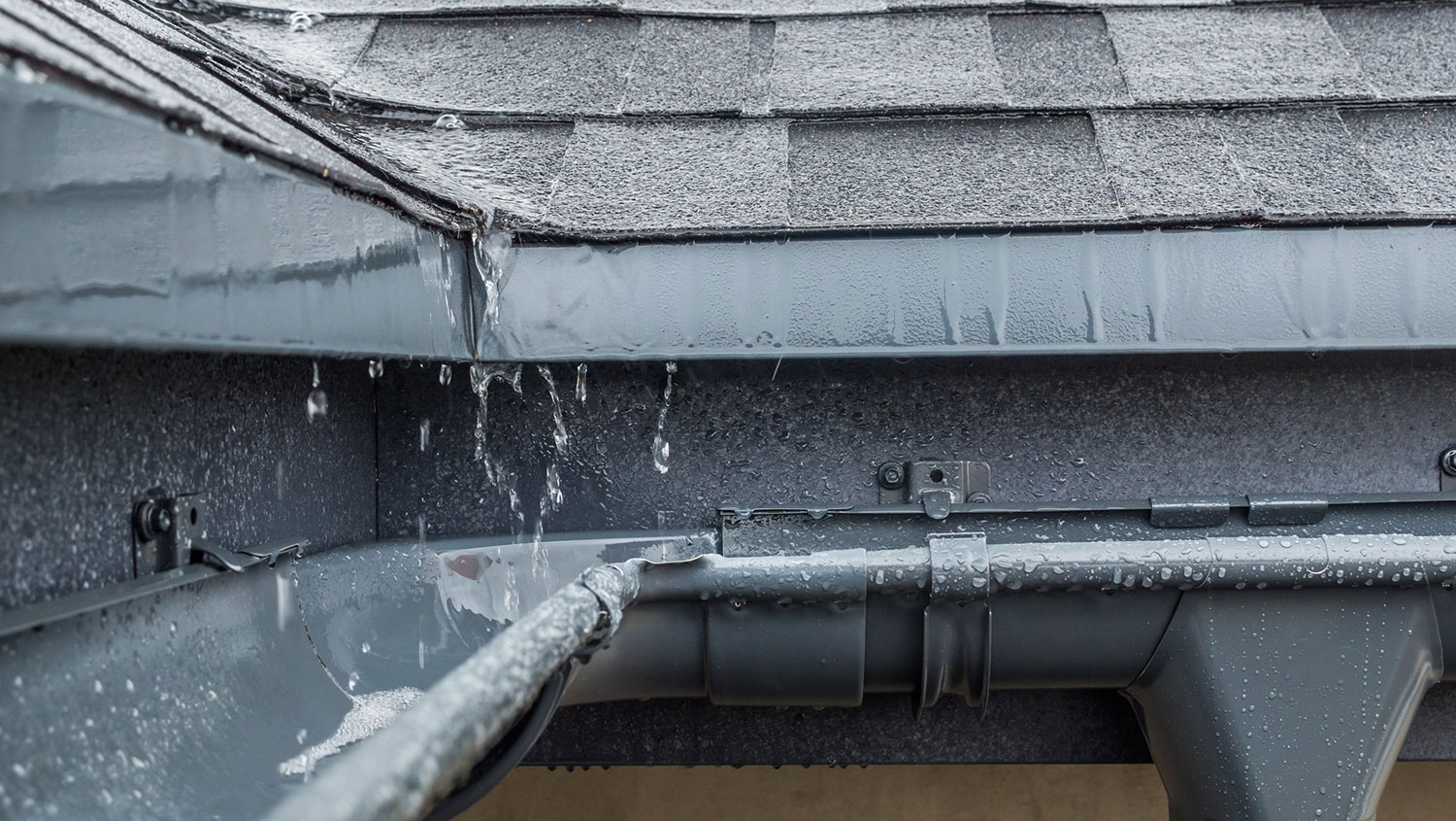 rain sending high water flow through gutters