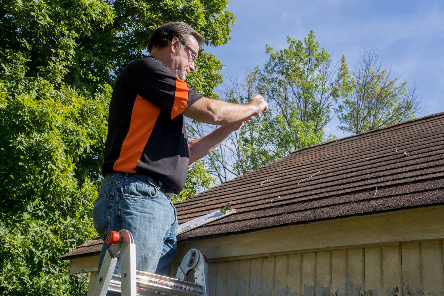 roofing ladder being used for inspection